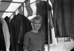 Jolly shopper among the clothing