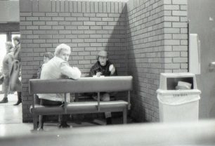 Three people at a table at The Agora cafe