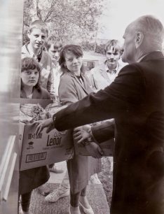 Frank Pipe receiving wood delivered  to door