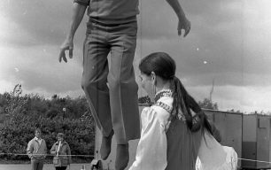 A man and woman trampolining