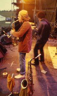 Saxophonist performing on stage at the Bowl