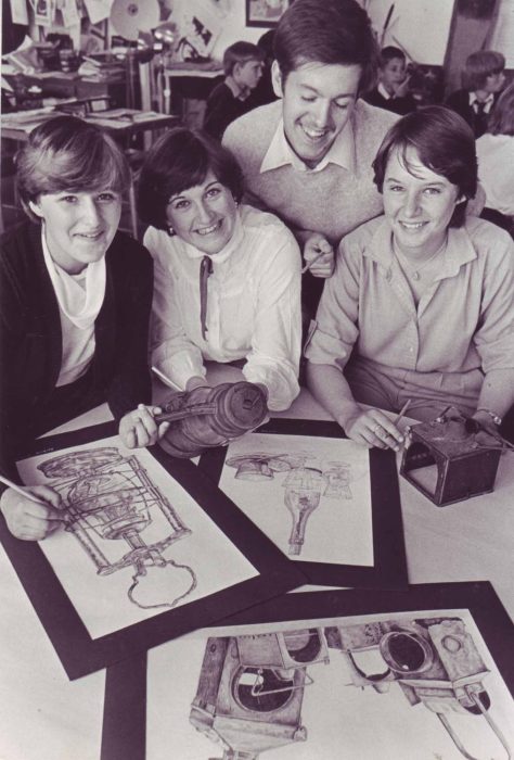 Teacher with three art students