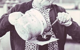 A woman pouring liquid into a mould