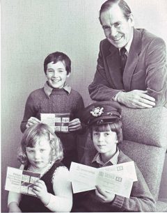 Three children with competition prizes
