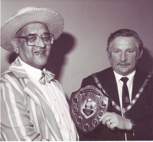 Clarence Gill receives the TSB Trophy from the Mayor