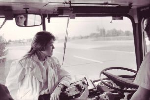 Passenger talking to driver on bus