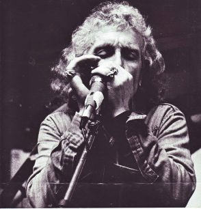 Tracy Walters playing harmonica