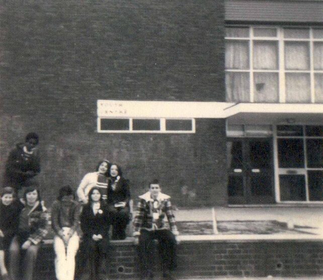 Club members sitting outside building