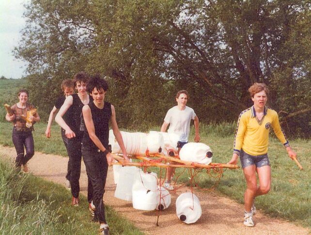 Group of youths carrying raft