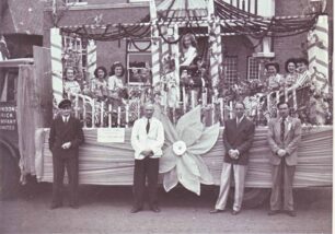 Carnival lorry with Alfred Cowlishaw in white jacket