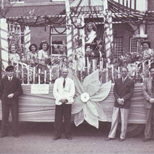 Carnival lorry with Alfred Cowlishaw in white jacket