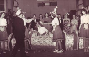 Lady emerging from box at function