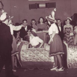 Lady emerging from box at function