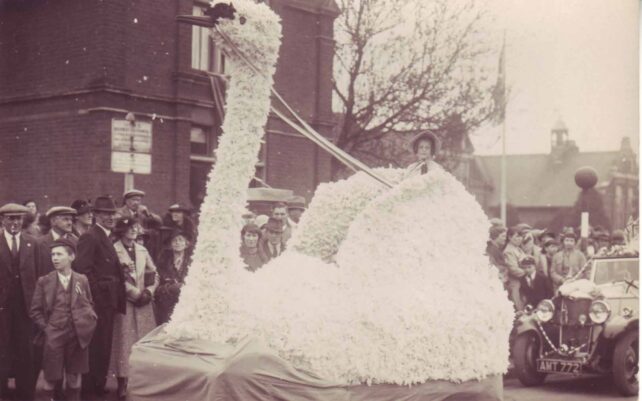 Lady seated on carnival swan