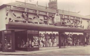 Cowlishaw shop front decorated for new King and Queen