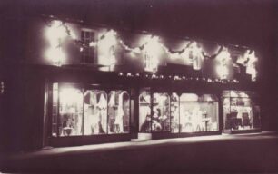 Cowlishaw`s shop display at night c1939