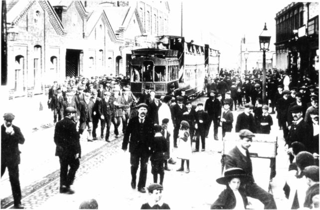 Men coming out of The Works, Stratford Road