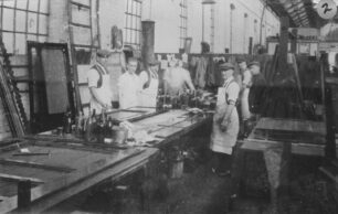 Polishers at benches in Bodyshop
