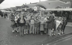 Knowles School pupils carol singing by the market, 16 December 1986