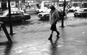 Pedestrian on rainy Queensway, December 1982