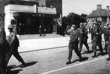 Home Guard parading past Studio Cinema, 1945