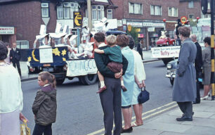 People watching Bletchley Carnival floats on Queensway - 1970s