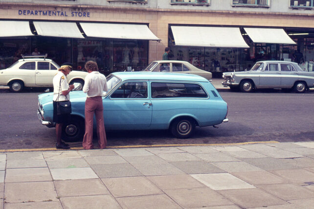 Traffic warden booking motorist outside Co-Op, circa 1970