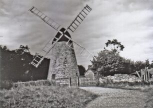 2 images of the windmill showing some repairs made by MKDC