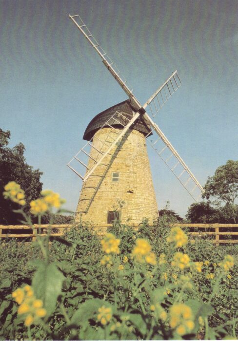 2 images of the windmill showing some repairs made by MKDC