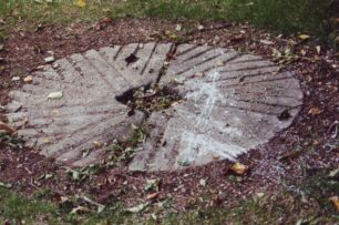 A mill bedstone set in turf