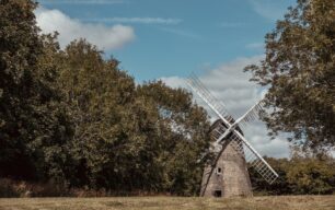 2 images of the windmill framed by trees