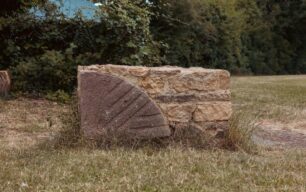 A quarter-bedstone set in free-standing stonework