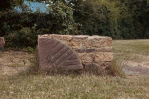 A quarter-bedstone set in free-standing stonework