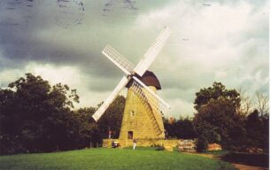 The picture side and obverse of a  franked postcard of the windmill 1982