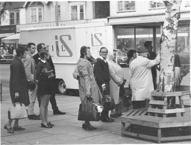 Boarding the bus opposite the Co-Op, undated