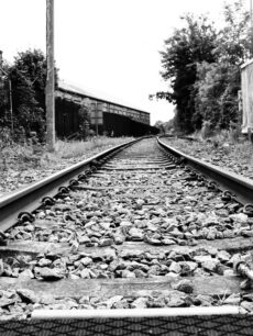 2 images of railway line from ground level