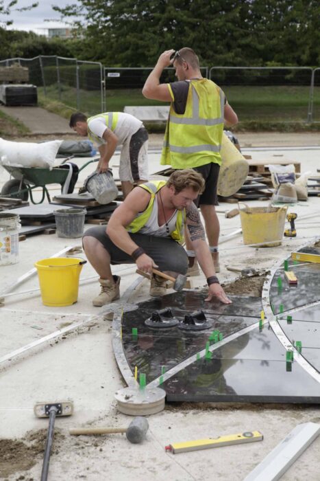 Installing the black  triangles and metal strips