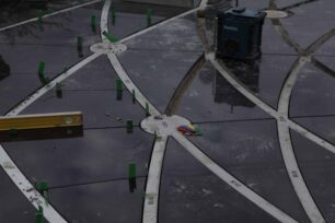 Installing the black  triangles and metal strips
