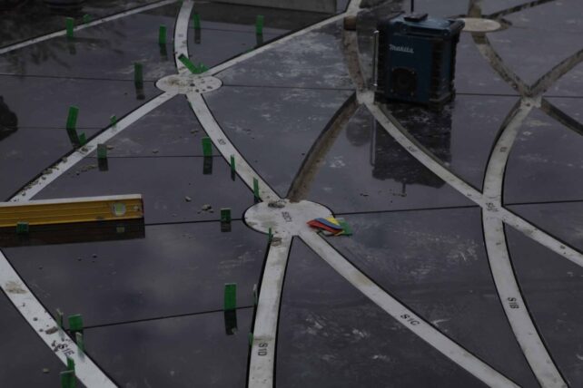 Installing the black  triangles and metal strips