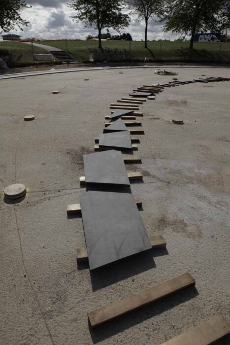 Laying out black tiles