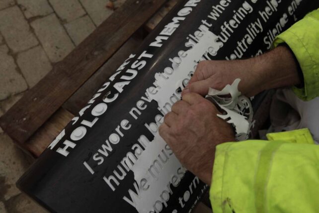 Reveal of lettering on pillars