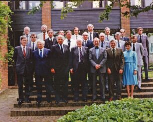 Photograph of members of the Milton Keynes Development Corporation Board with the Executive Management Committee (EMC) outside Wavendon Tower